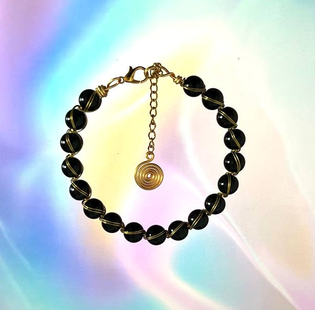 "Noir Spiral", Black Onyx & Gold Wire-Wrapped Bracelet
