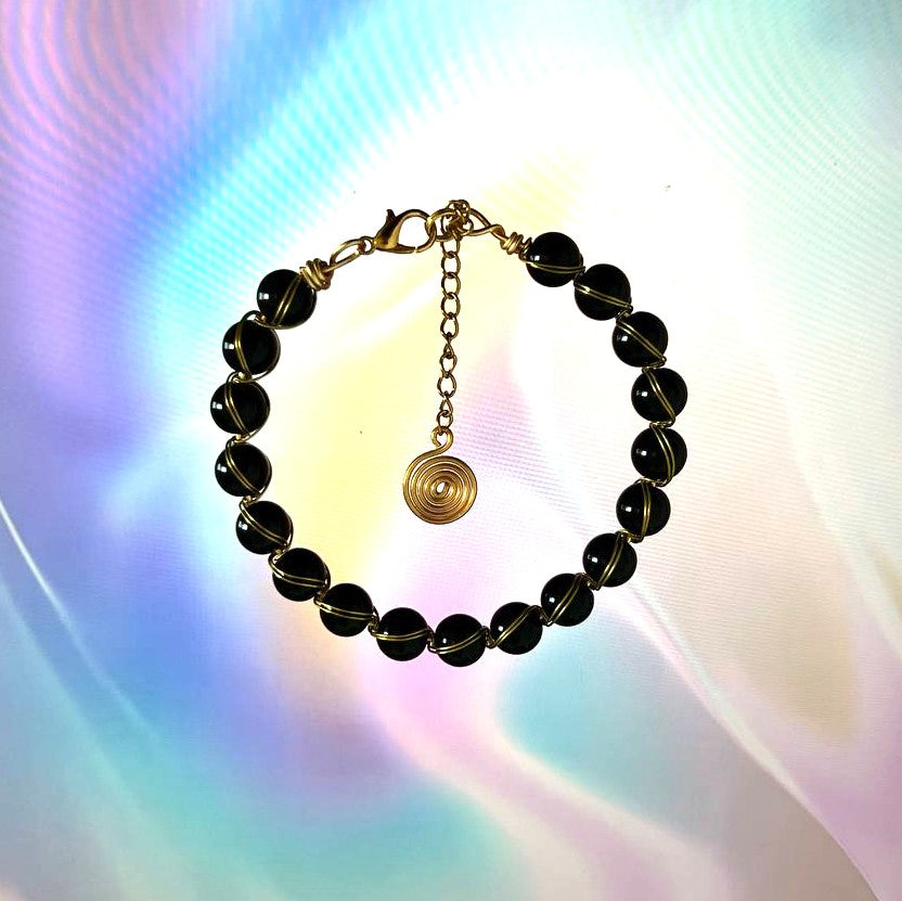 "Noir Spiral", Black Onyx & Gold Wire-Wrapped Bracelet