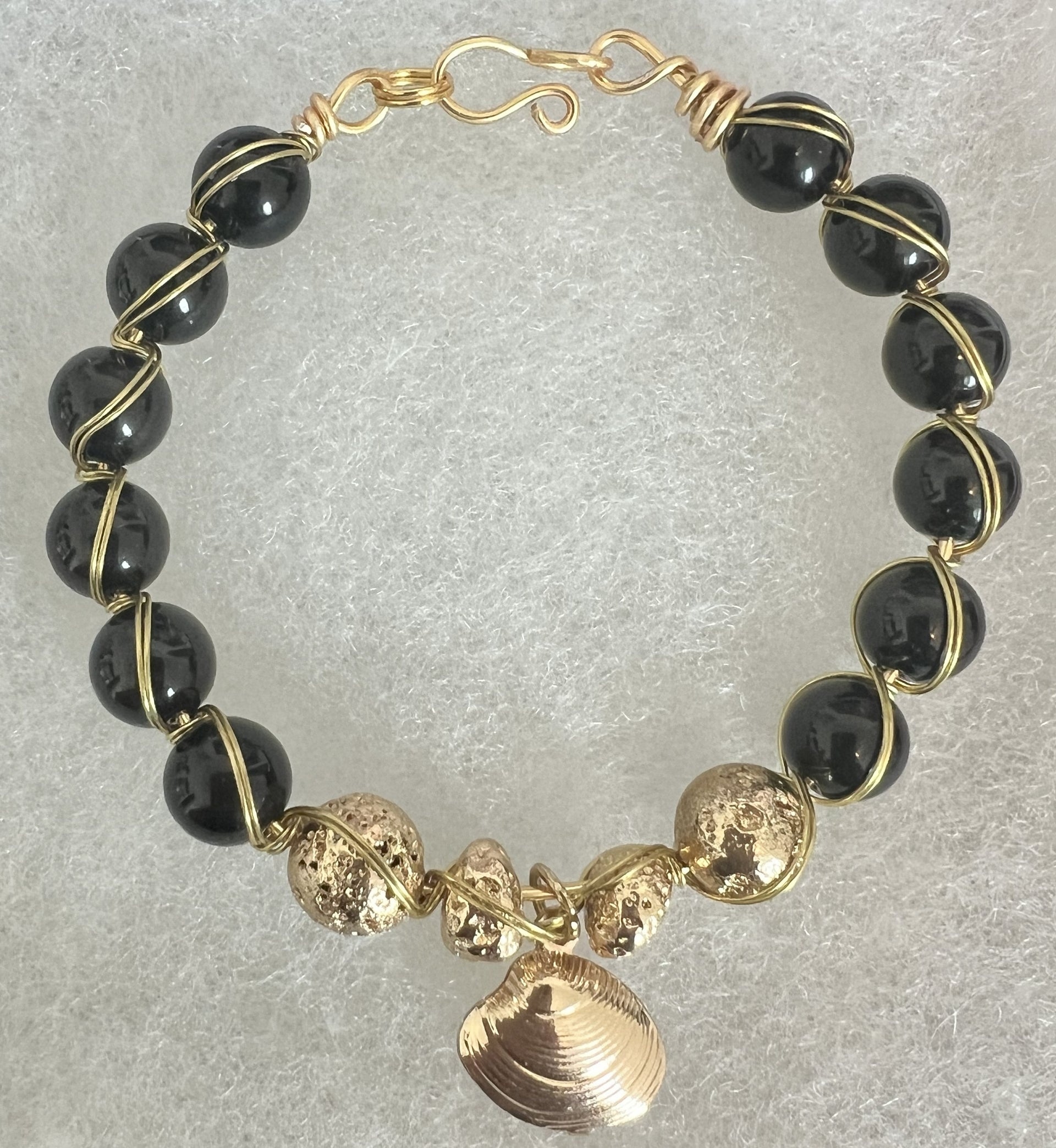 “Midnight Shore” Onyx & Gold Wire-Wrapped Bracelet with Seashell Charm