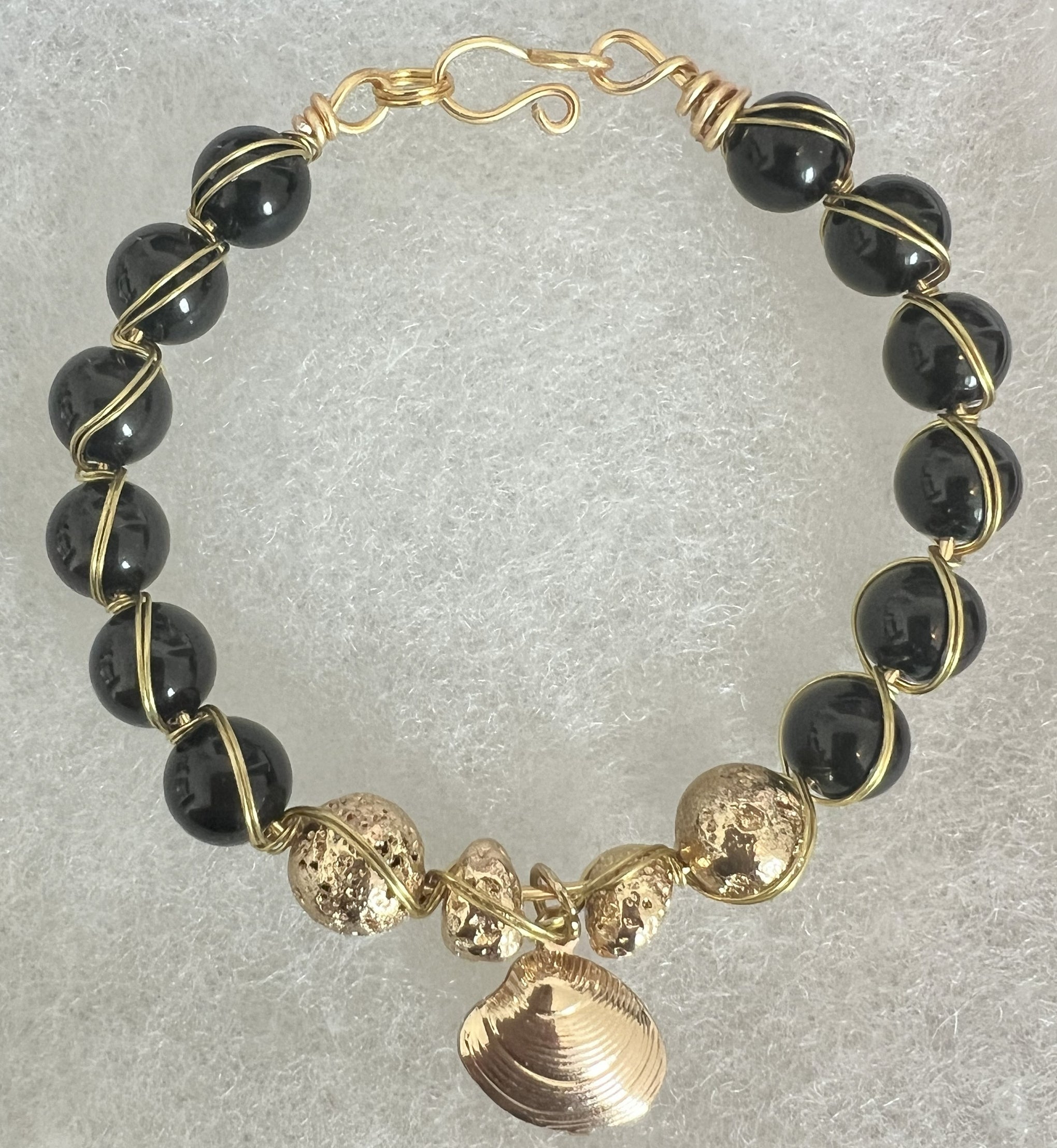 “Midnight Shore” Onyx & Gold Wire-Wrapped Bracelet with Seashell Charm